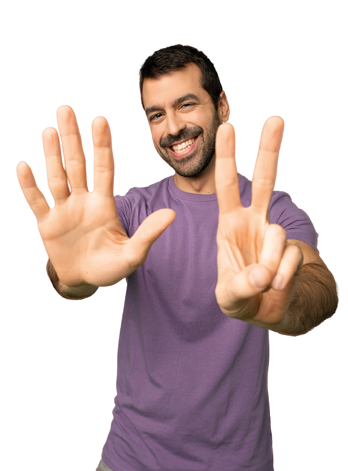 Handsome man counting seven with fingers on isolated pink background