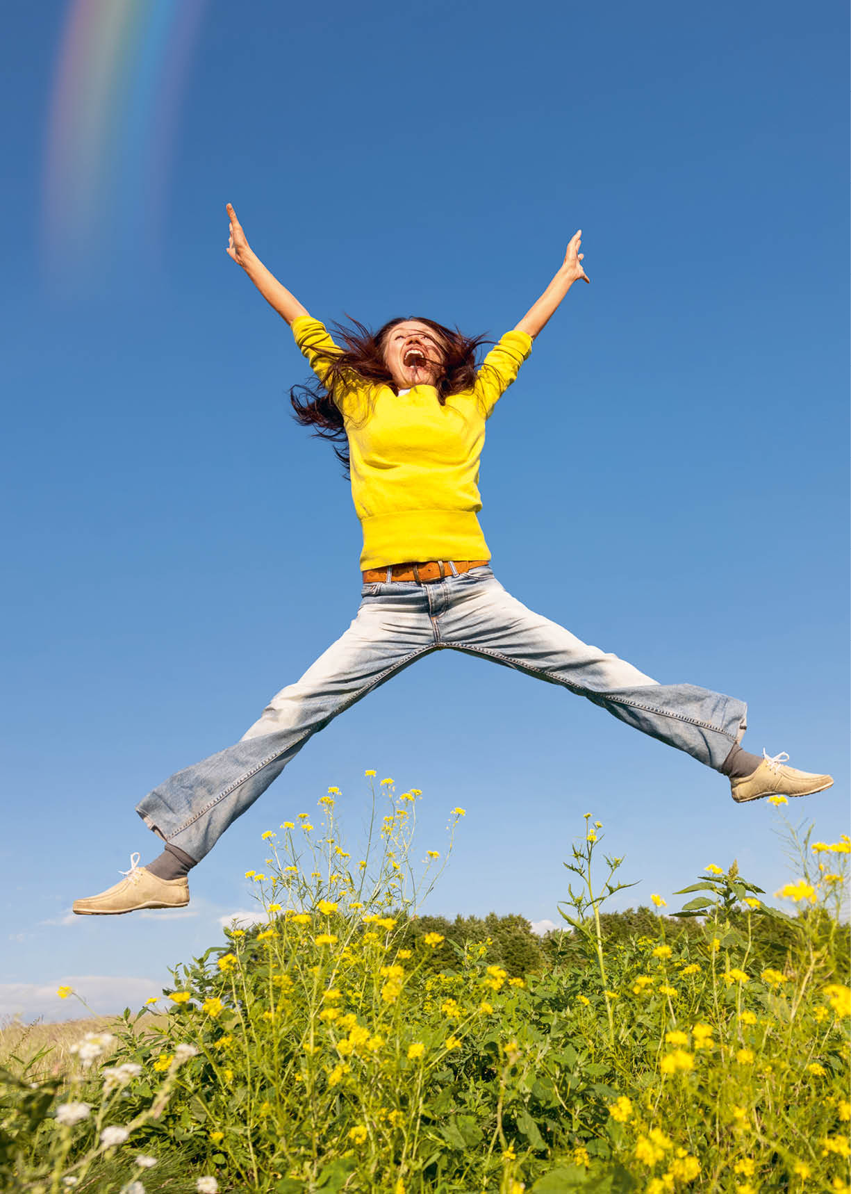 Happy smiling young man jumping on the beach. Freedom concept. Enjoyment.