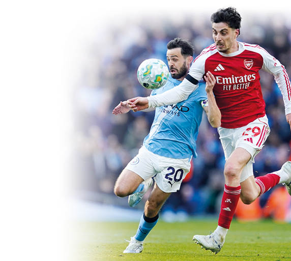 Manchester City's Bernardo Silva challenges for the ball with Arsenal's Kai Havertz during the English Premier League soccer match between Manchester City and and Arsenal, in Manchester, England, Sunday, April 19, 2026. (AP Photo/Dave Thompson)